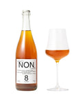 Bottle and glass of non-alcoholic beverage labeled 'NON' on a white background