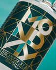 Zero Alcohol Gin bottle with geometric design on a teal background