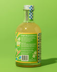 Bottle of juice with a label on a green background
