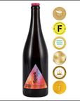 Black bottle of 'Three Spirit' wine with colorful label and multiple gold awards on a white background