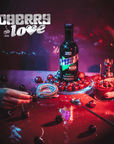 Bottle of Cherry Love liquor on a dark surface with cherries and decorative elements.