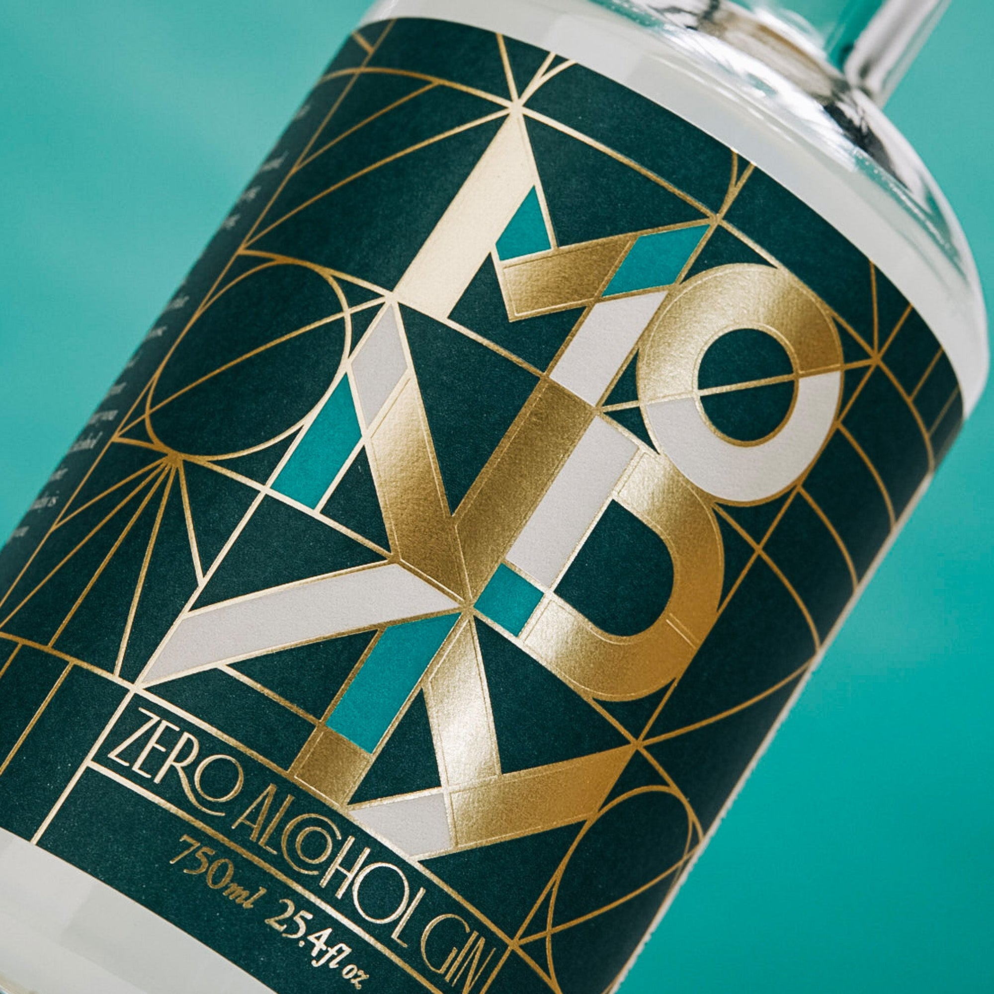Zero Alcohol Gin bottle with geometric design on a teal background