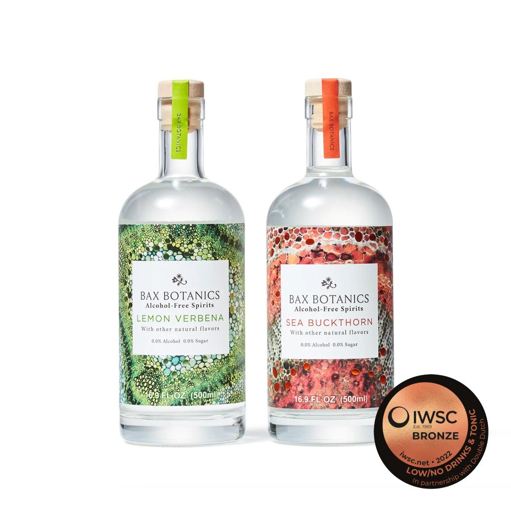 Two bottles of Bax Botanics: Lemon Verbena with green label and sea buckthorn with red label 